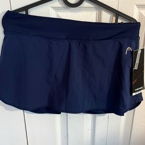 Head brand, size small, never worn, navy blue tennis skirt